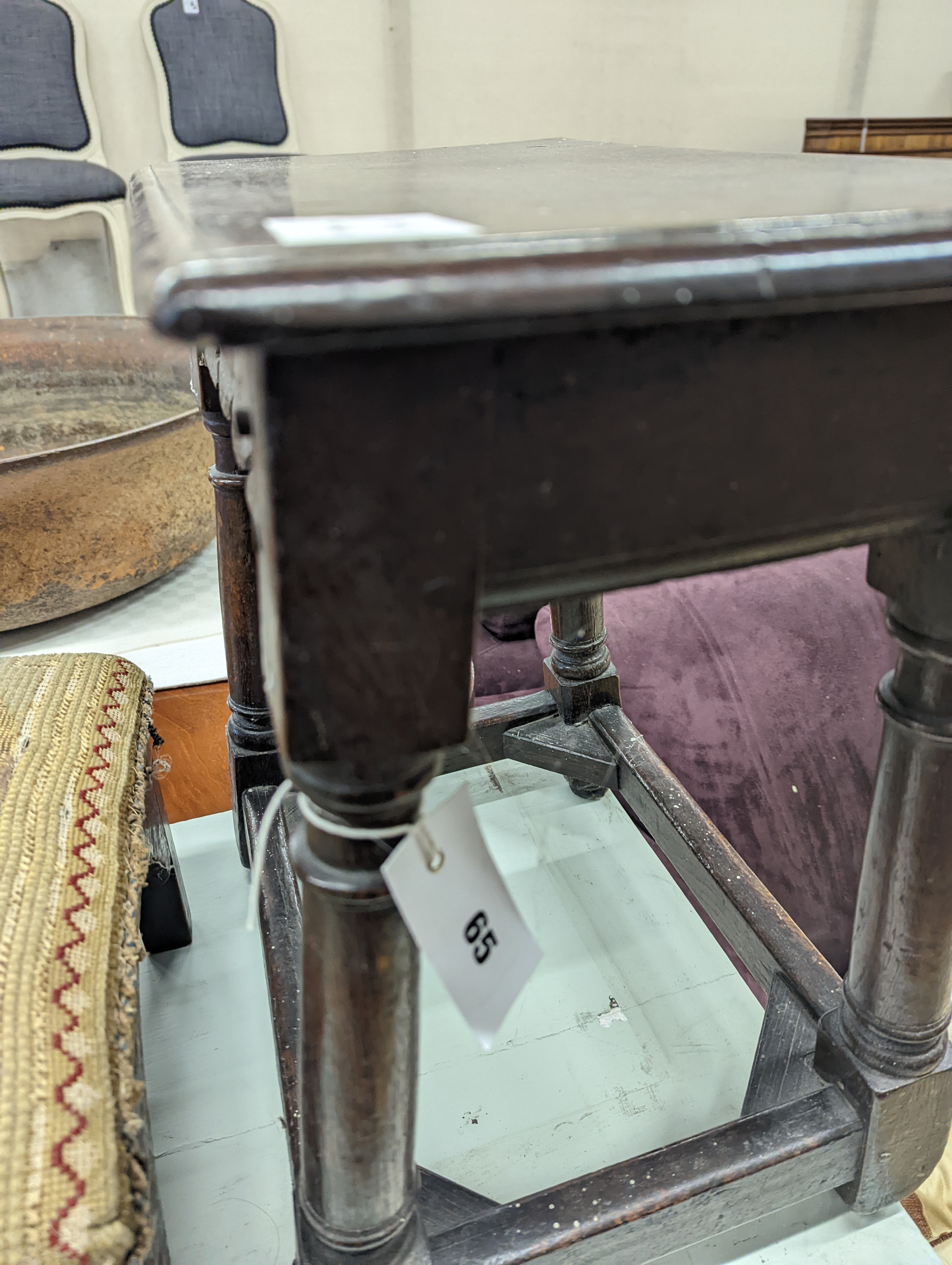 A 17th century style oak joint stool, width 46cm, depth 26cm, height 46cm and a George III stool with Victorian needlework seat, length 33cm